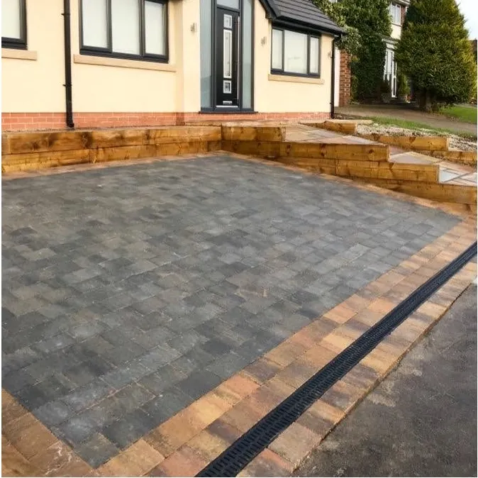 Charcoal block paving drive edged with timber sleepers