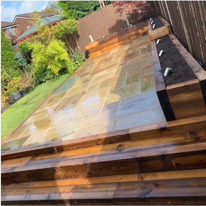 Oak sleeper retaining wall beside a wet slab path