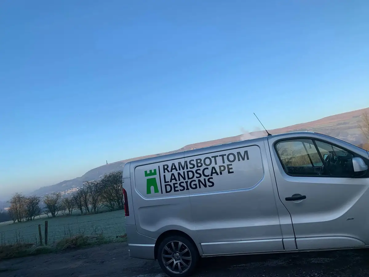 Ramsbottom Landscape Designs van parked up at dawn with the hills behind